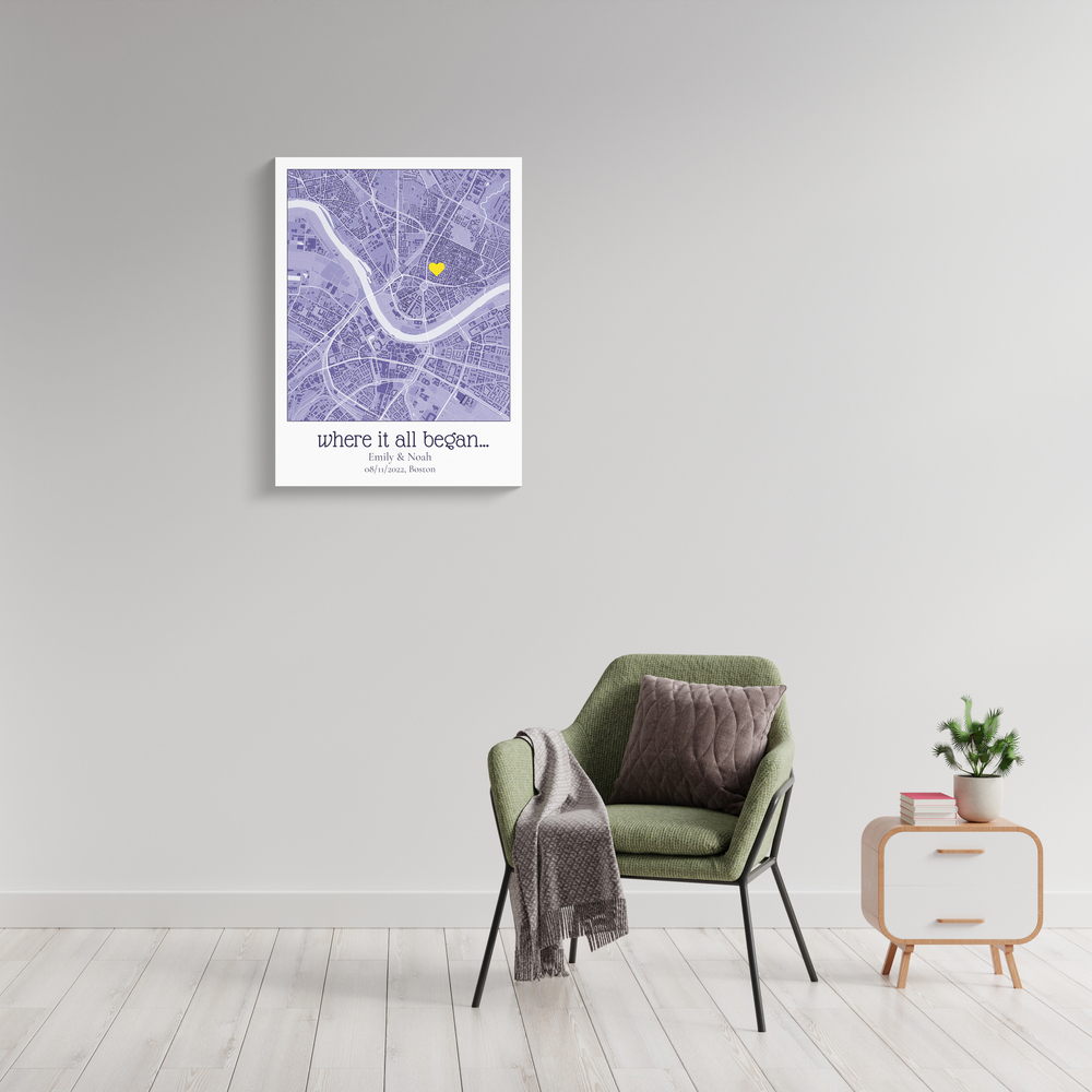 Purple city map with a yellow heart and personalized text on a gray wall beside a green armchair.
